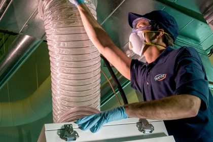 DUCTZ franchise technician cleaning air duct