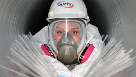 DUCTZ Franchise employee cleaning inside a duct