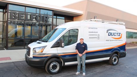 DUCTZ air duct cleaning franchise owner stands with van